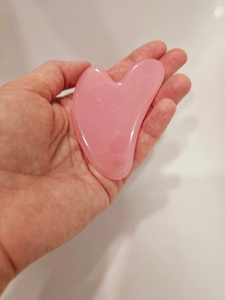 Gua sha rozā kvarca akmens masāžai