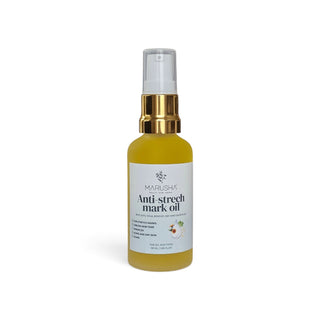 A bottle of Marusha Anti-stretch mark oil with a gold pump and clear cap, containing yellow oil, on a white background.