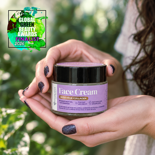 Marusha Vege-COLLAGEN face cresm in their hands against a blurred green outdoor background. A 'Global Green Beauty Awards Finalist 2026' badge is visible in the top left corner.