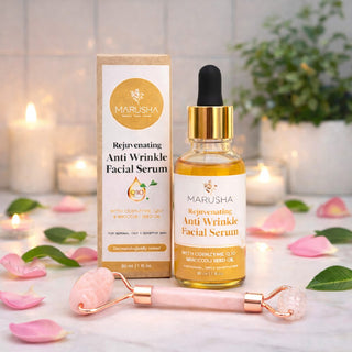 Marusha rejuvenating anti wrinkle facial serum with packaging and face massage roller on a decorative background.