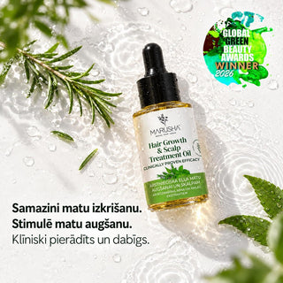 A bottle of Marusha Hair Growth & Scalp Treatment Rosemary and Amla Oil is displayed on a white background with water droplets, green leaves, and rosemary sprigs. The image includes Latvian promotional text and a 'Global Green Beauty Awards Winner 2026' badge.