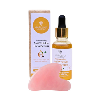 Dabīgs sejas serums ar guasha sejas masāžai un redzamu seruma pudelīti ar kastīti