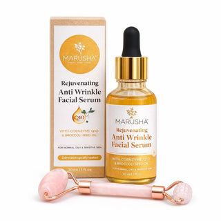 Dabīgs sejas serums un sejas masāžas rullītis un redzamu seruma pudelīti ar kastīti